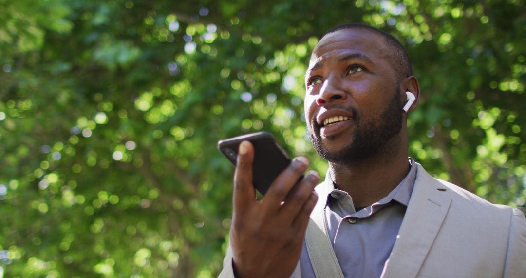 Tech-Savvy Young Professional Using Smartphone Outdoors