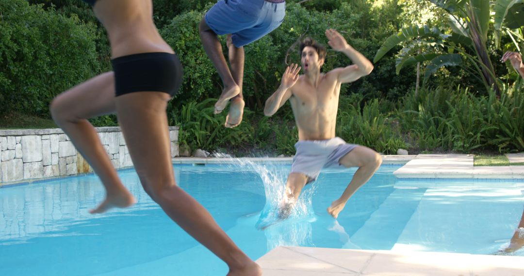 Group of Friends Joyfully Jumping into Swimming Pool - Free Images, Stock Photos and Pictures on Pikwizard.com