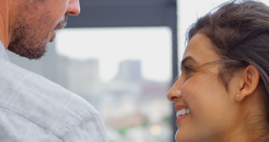 Interracial Couple Smiling Sharing a Warm Moment