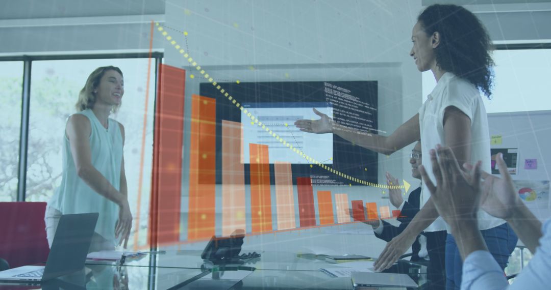 Businesswomen Shaking Hands in Modern Office with Data Interface