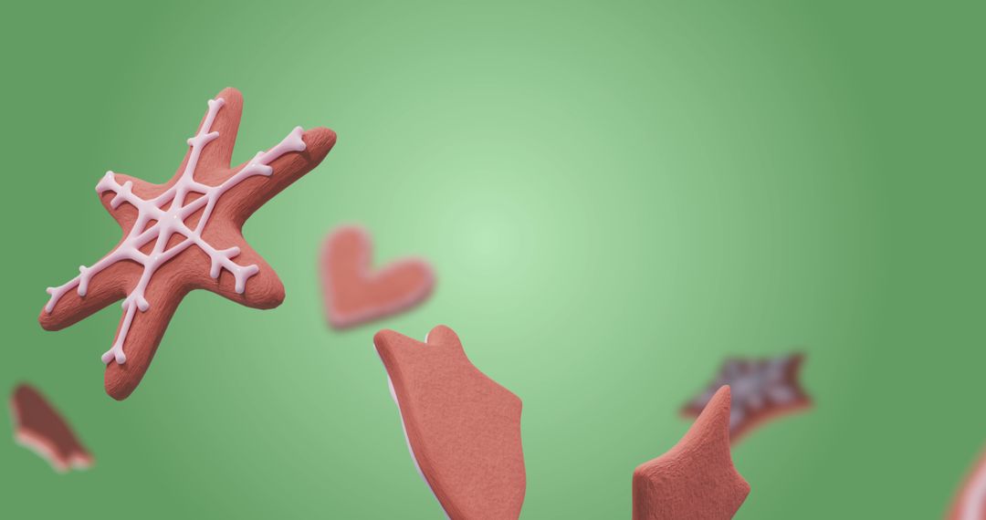 Festive Gingerbread Cookies Falling Against Green Backdrop