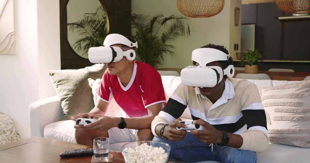 Gamers Engaging in VR Experience on Comfortable Sofa with Snacks