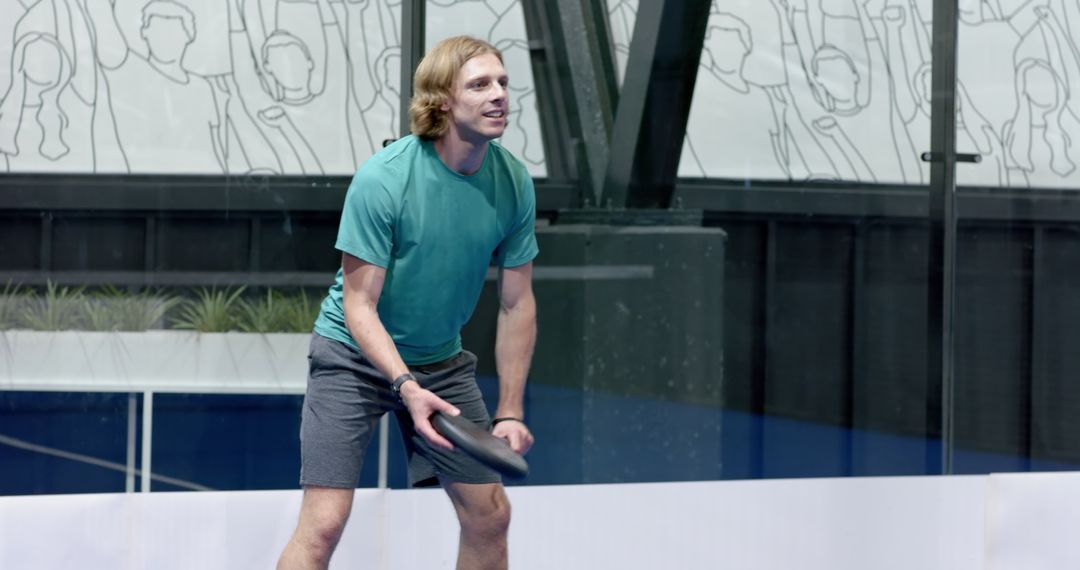 Happy Man Playing on Court with Flying Disc