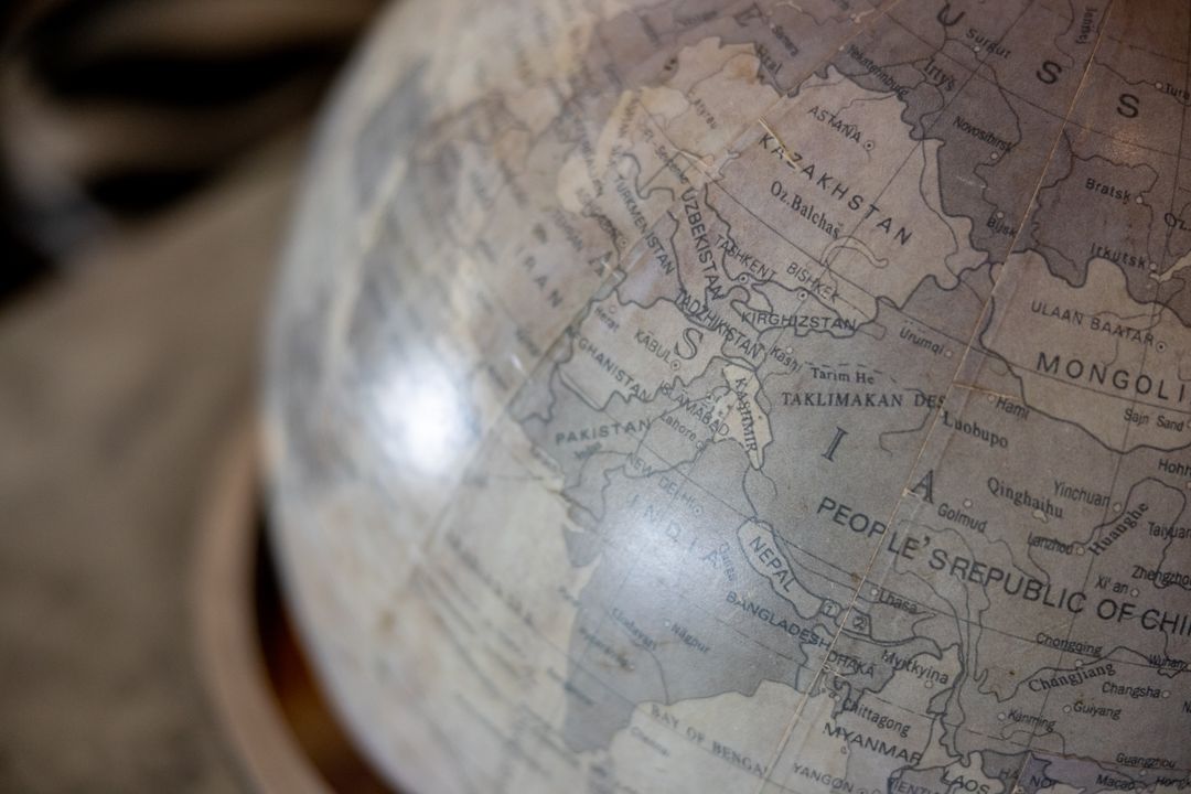 Vintage Globe Showing Central and South Asia Map Detail with Muted Neutral Tones and Antique Cartogr