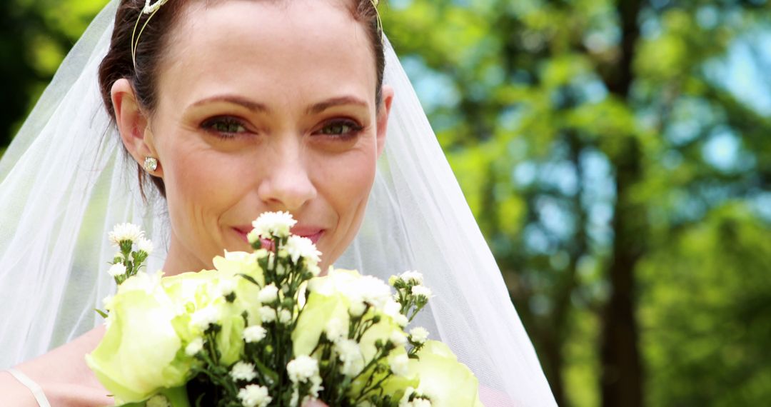 Smiling Bride Holding White Flowers Bouquet on Wedding Day - Free Images, Stock Photos and Pictures on Pikwizard.com