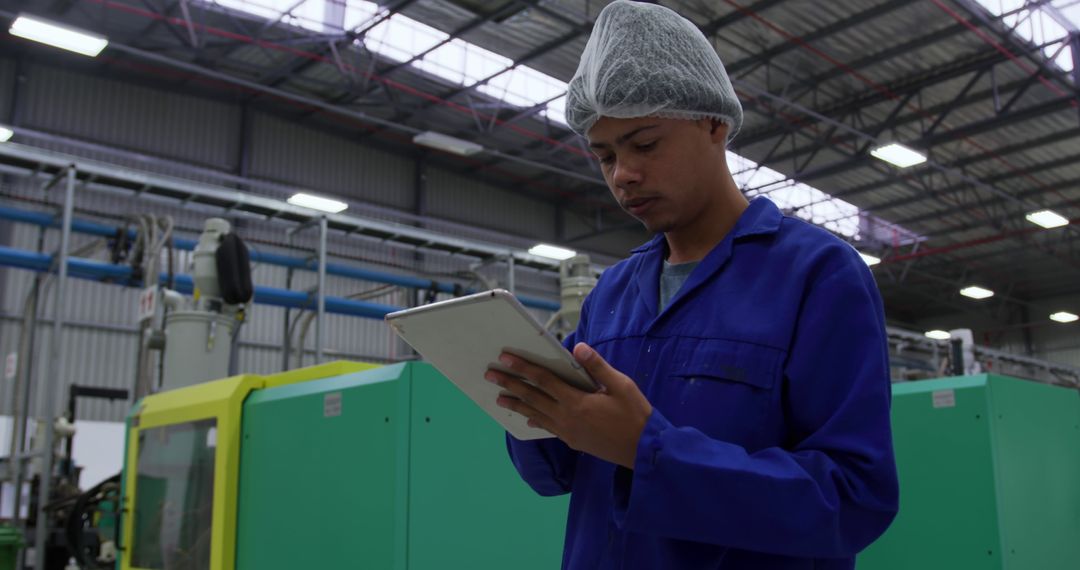 Factory Worker Using Tablet for Machine Inspection - Free Images, Stock Photos and Pictures on Pikwizard.com