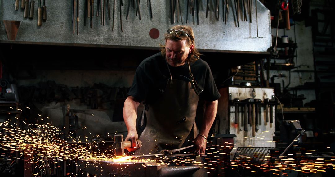 Blacksmith Working with Intensity in Industrial Workshop