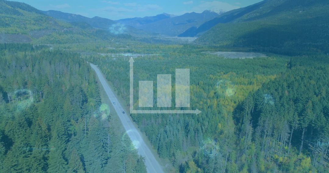 Aerial View of Mountain Highway Surrounded by Lush Forest