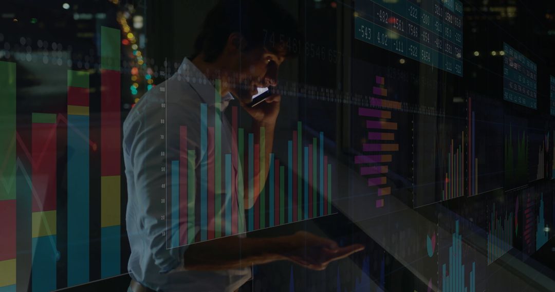 Business Analyst Examining Data with Digital Charts in Office at Night