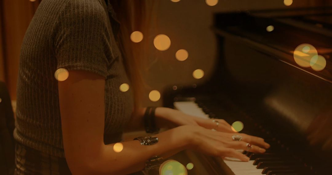Skilled Pianist Performing in Ambient Setting with Bokeh Lights
