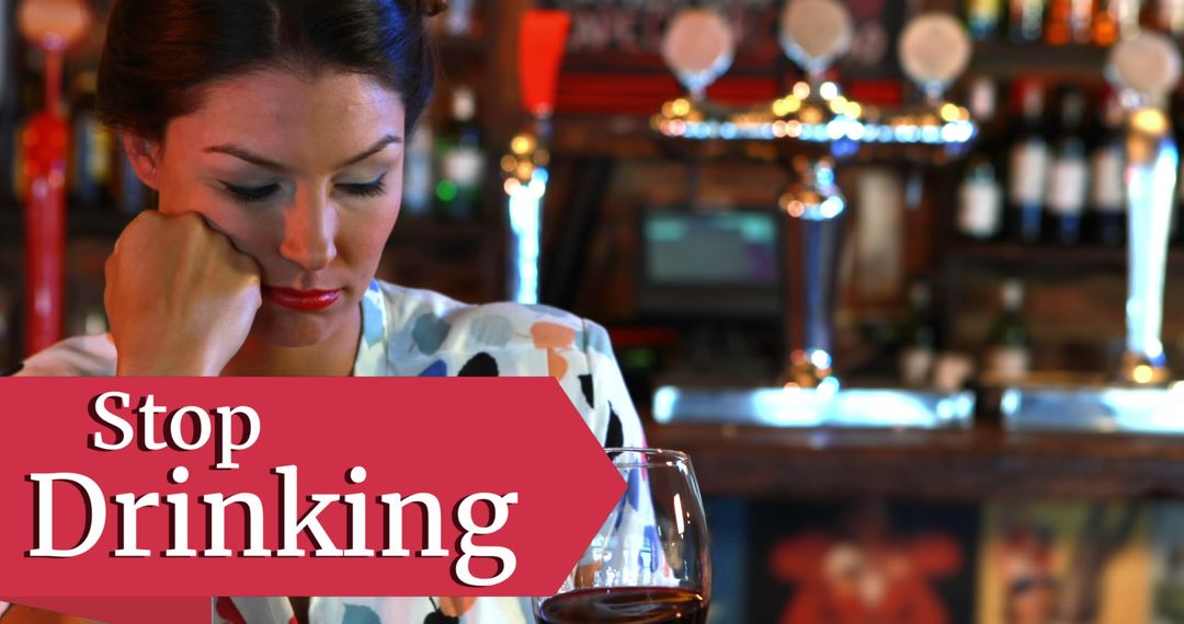 Woman Pondering Next to Stop Drinking Text in Dimly Lit Bar