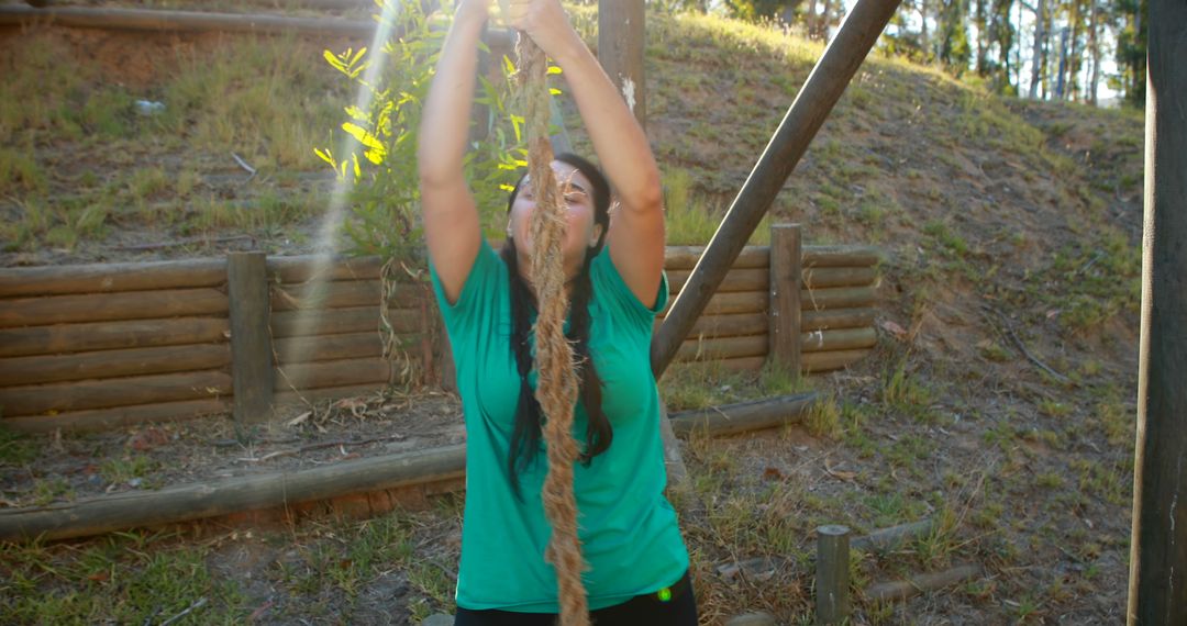 Woman Climbing Rope in Outdoor Adventure Course - Free Images, Stock Photos and Pictures on Pikwizard.com