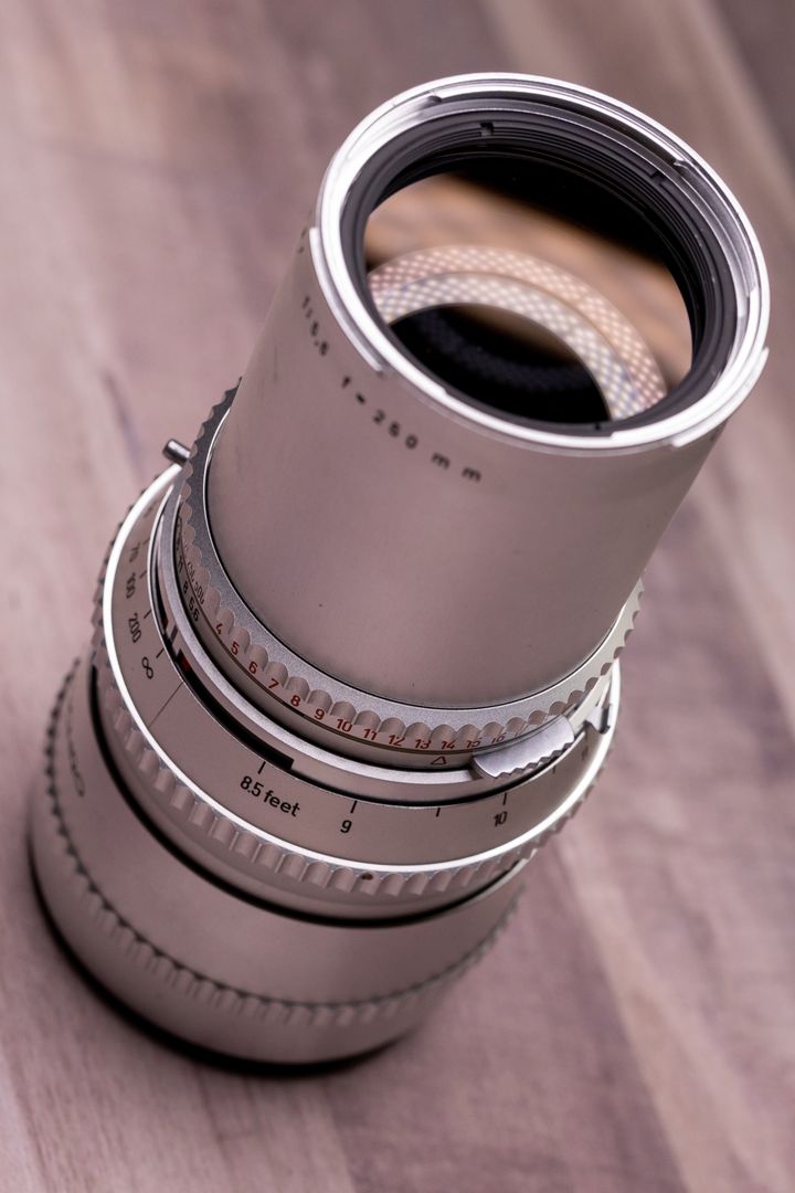 Technology vintage camera lens on wooden surface displaying optical elements