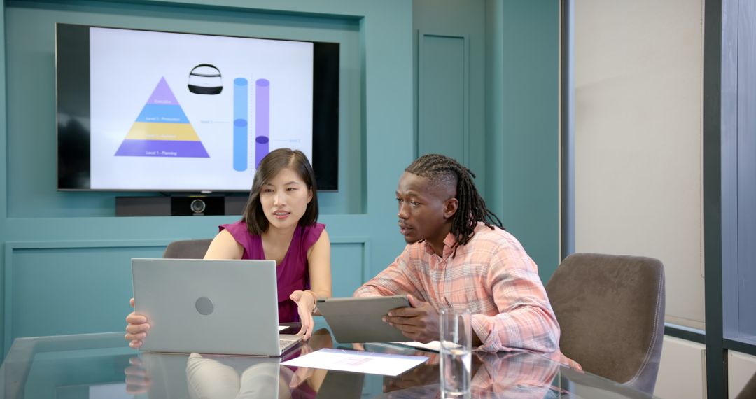 Colleagues Collaborating on Project with Digital Devices