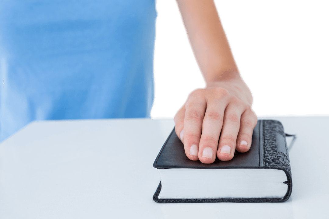 Hand Placed Delicately on Bible with Transparent Background