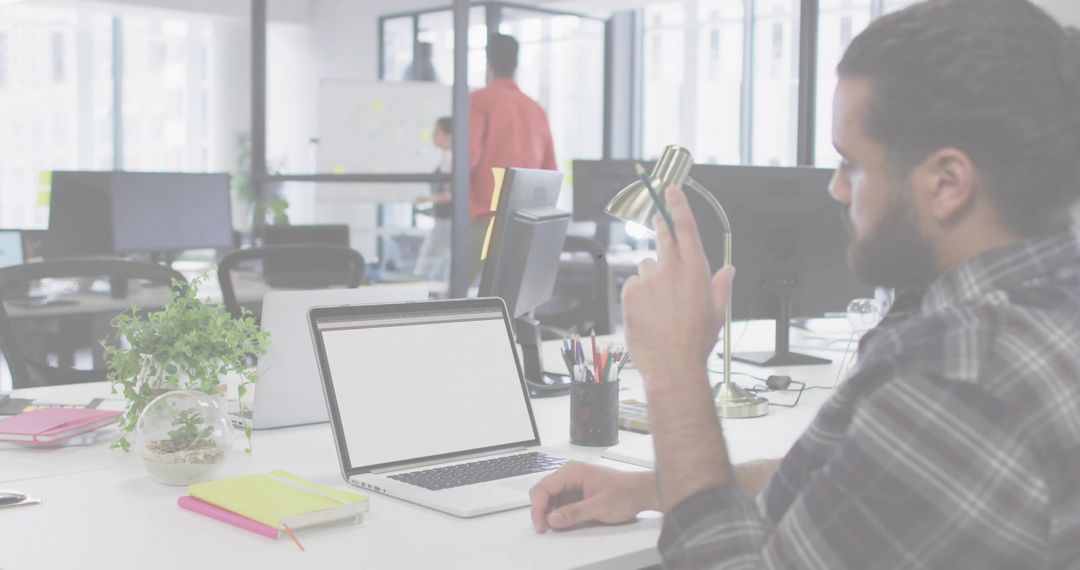 Man Working in Modern Open Office, Team Collaborating
