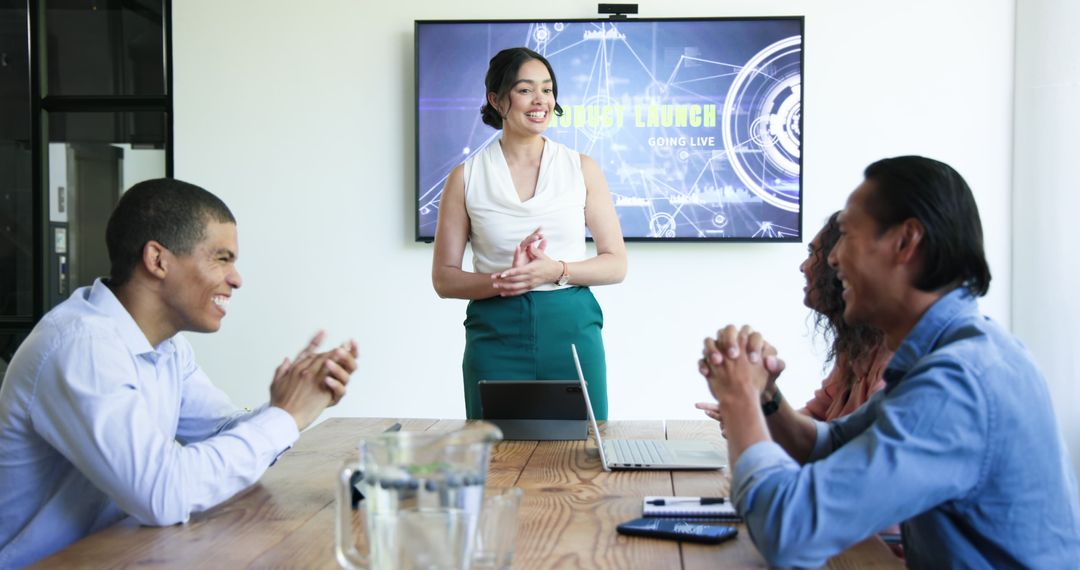 Diverse Team Celebrating Successful Presentation in Modern Office