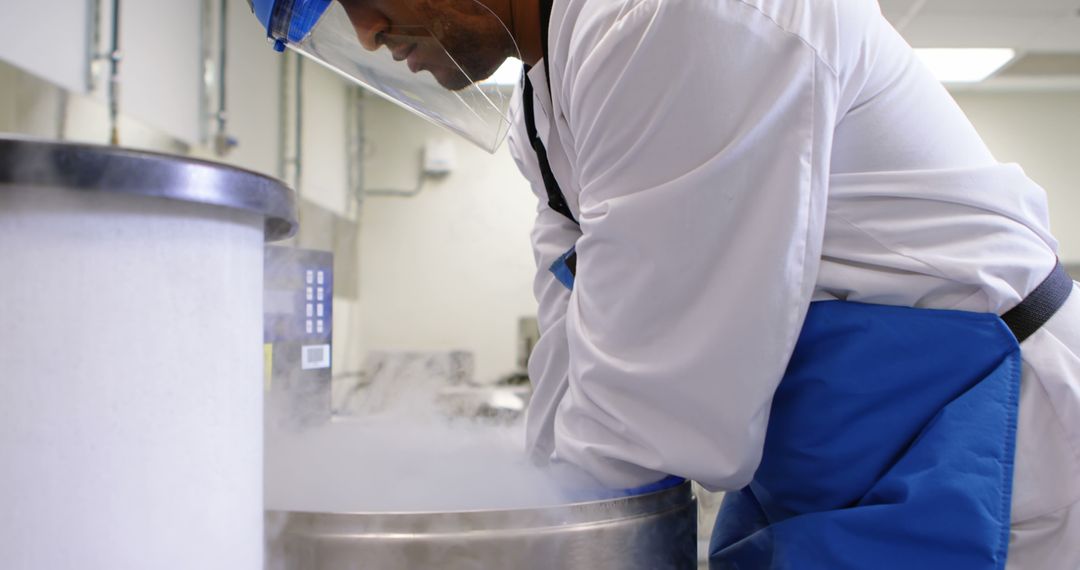 Scientist Working with Cryogenic Equipment in Laboratory - Free Images, Stock Photos and Pictures on Pikwizard.com