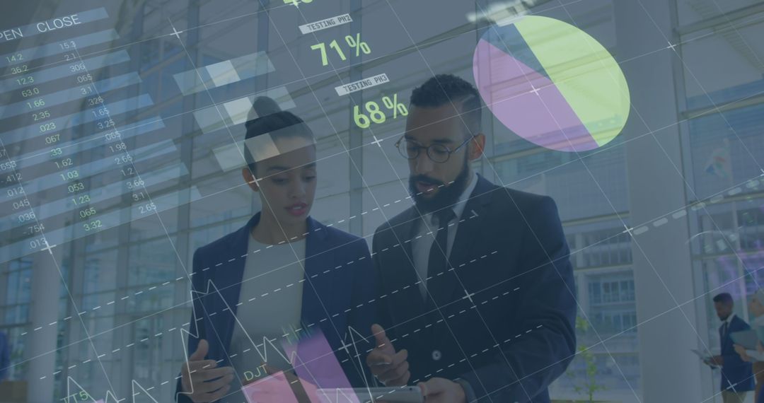 Business Analysts Reviewing Digital Data with Financial Charts