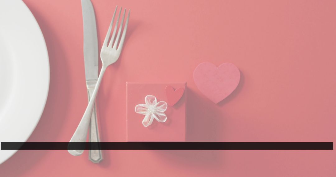 Valentine Coral Flatlay Displaying Gift Box with Organza Bow, Hearts and Silverware