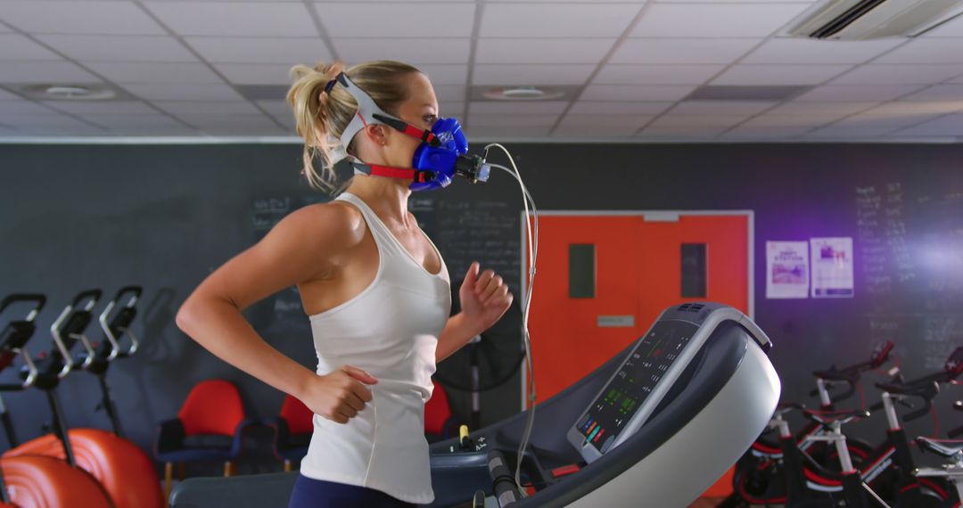 Female Athlete Running on Treadmill with Mask in Gym - Free Images, Stock Photos and Pictures on Pikwizard.com