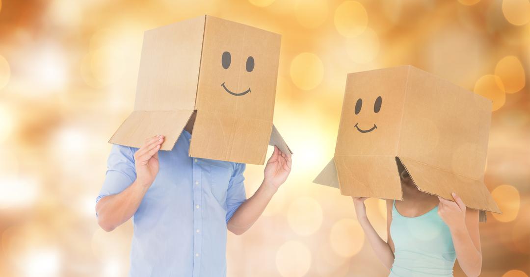 Couple with emojis on cardboard boxes over bokeh - Free Images, Stock Photos and Pictures on Pikwizard.com