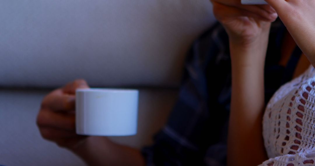 Couple Relaxing with Coffee and Casual Conversation Indoors