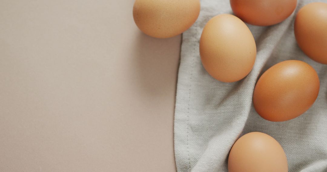 Brown Eggs on Beige Cloth and Neutral Background - Free Images, Stock Photos and Pictures on Pikwizard.com