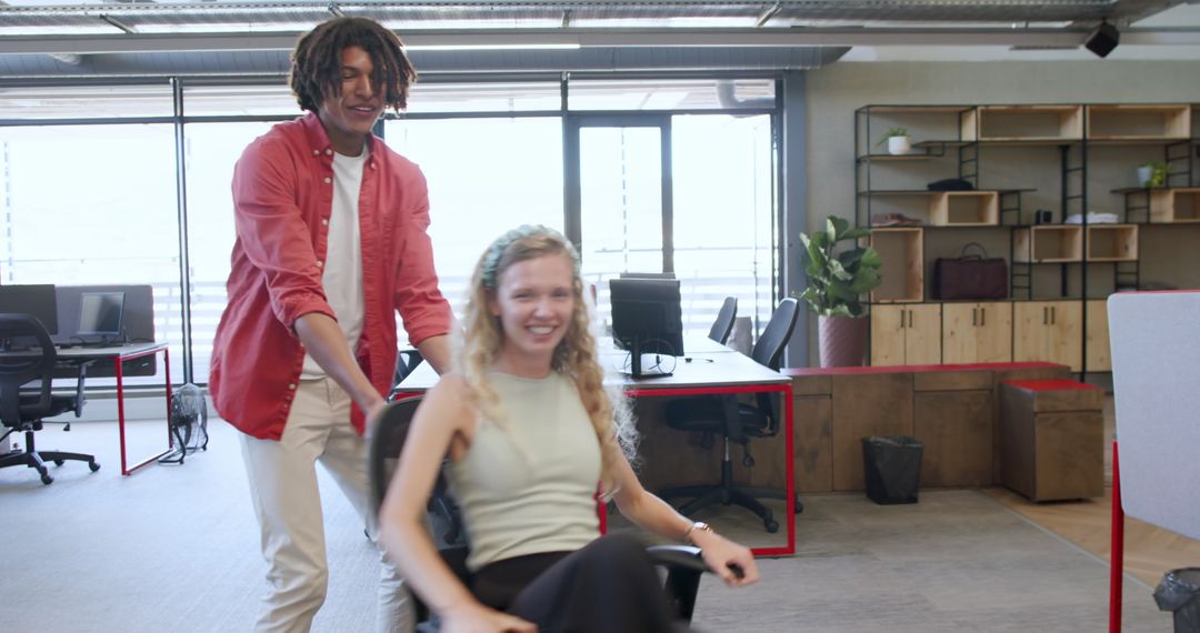 Colleagues Enjoying Workspace Collaboration in Modern Office