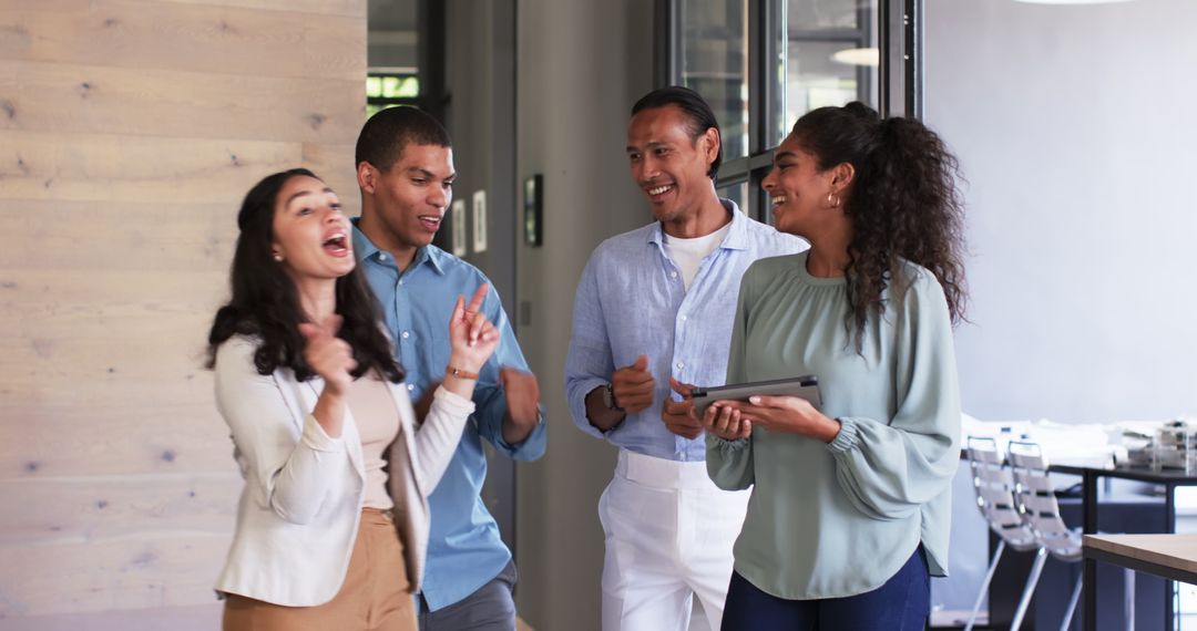 Diverse Business Team Celebrating Success with Enthusiasm