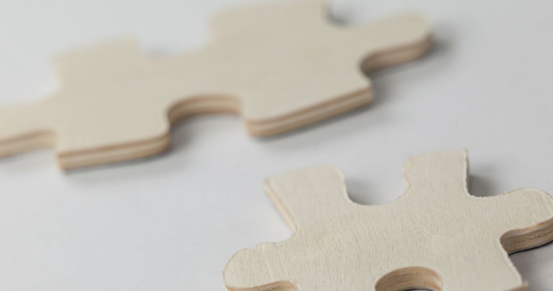 Natural Wood Puzzle Pieces on White Surface