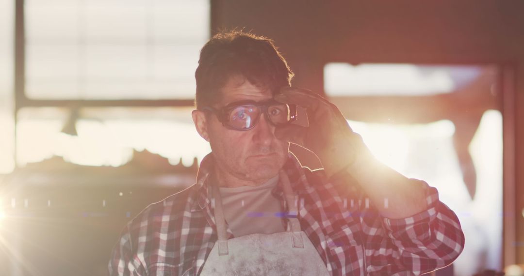 Workshop Craftsman Adjusting Safety Goggles with Sunlight Effect
