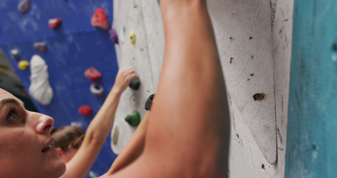 Individuals Rock Climbing at Indoor Gym - Free Images, Stock Photos and Pictures on Pikwizard.com