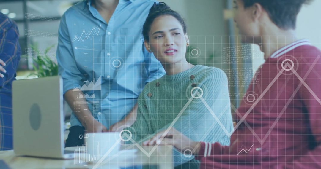 Business Team Analyzing Financial Data with Digital Graphs in Office
