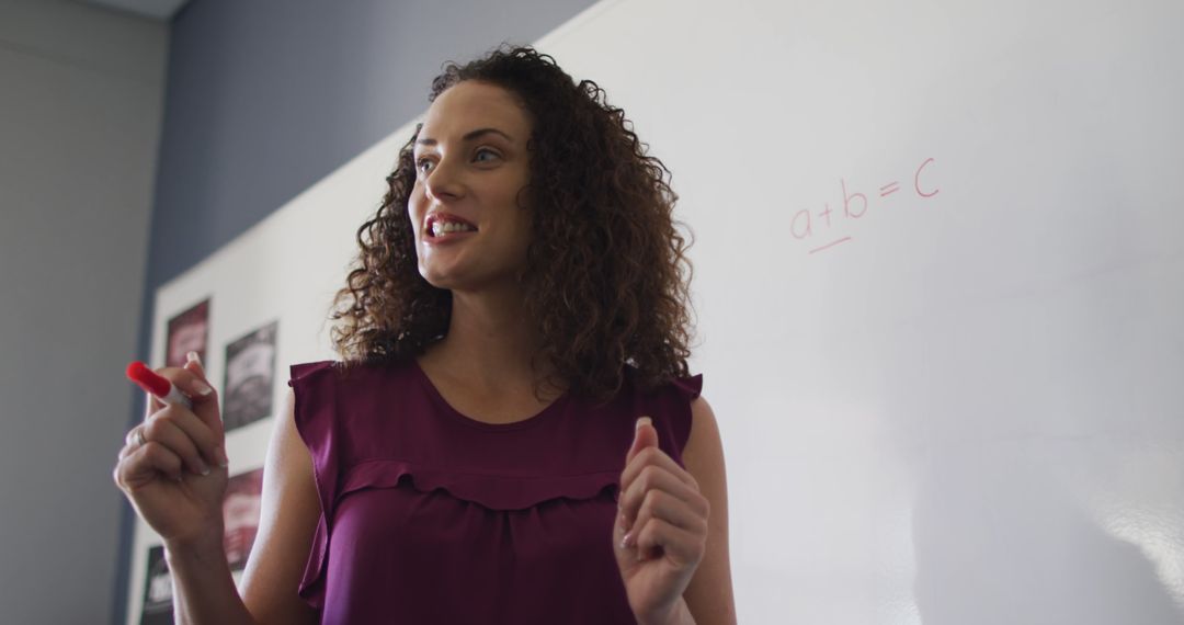 Smiling Teacher Explains Algebra at Classroom Whiteboard - Free Images, Stock Photos and Pictures on Pikwizard.com