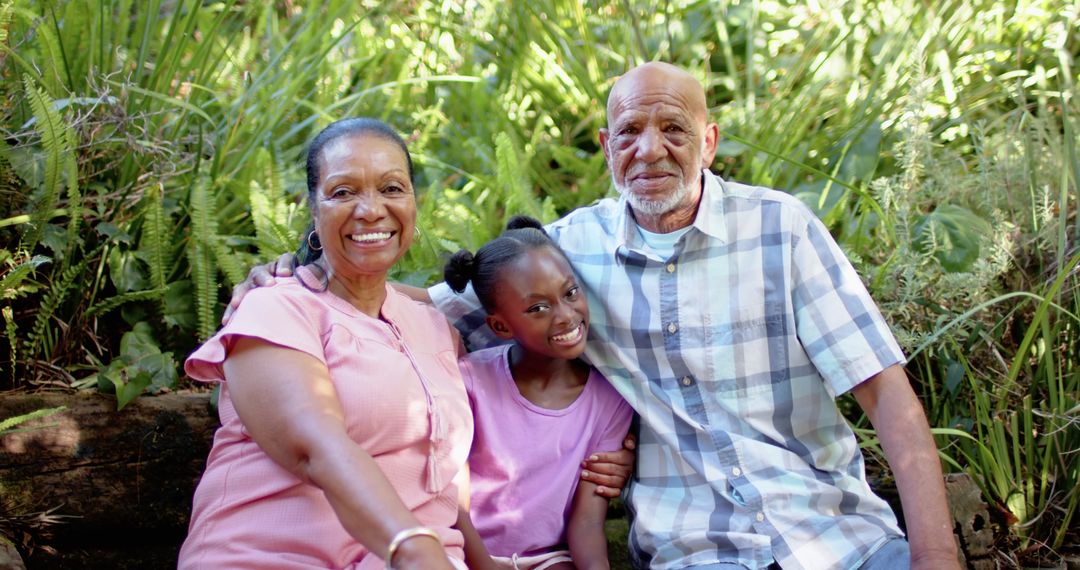 Smiling Multigenerational Family in Lush Garden Setting