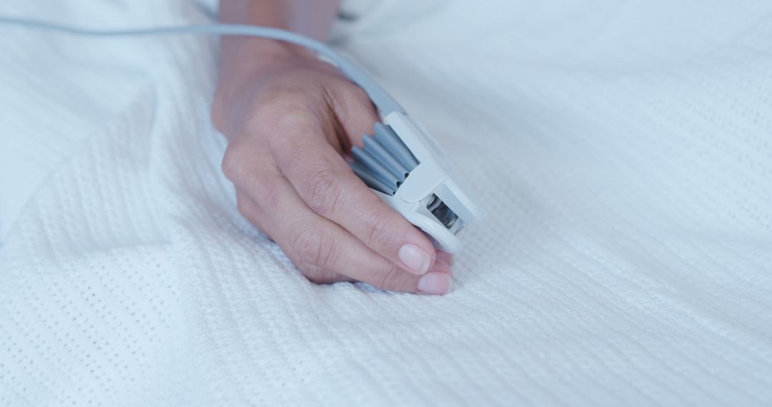 Hand with Pulse Oximeter on Hospital Bed - Free Images, Stock Photos and Pictures on Pikwizard.com