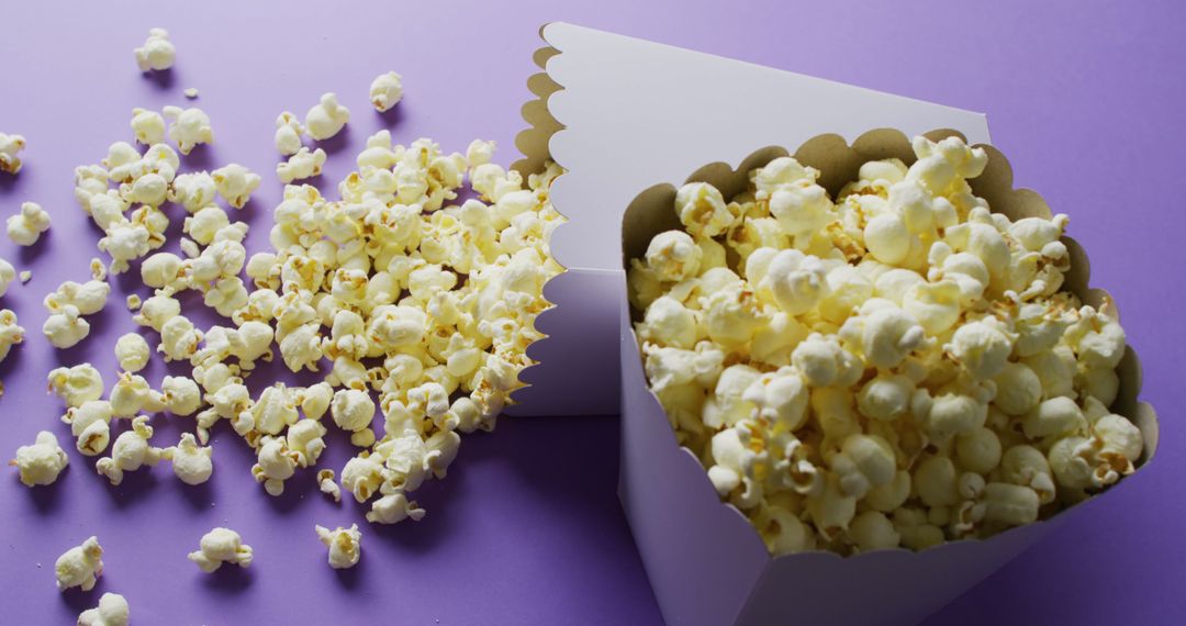 Popcorn in White Tubs on Purple Background - Free Images, Stock Photos and Pictures on Pikwizard.com