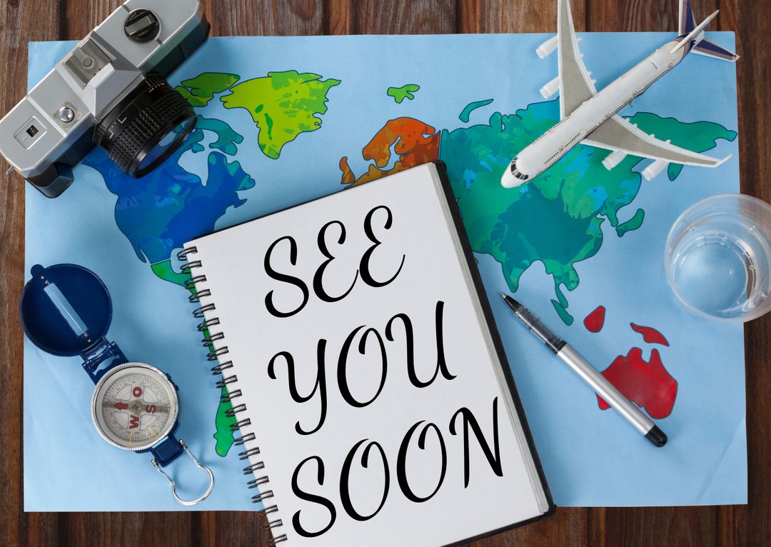 Travel Inspiration with Map, Camera and See You Soon Notebook