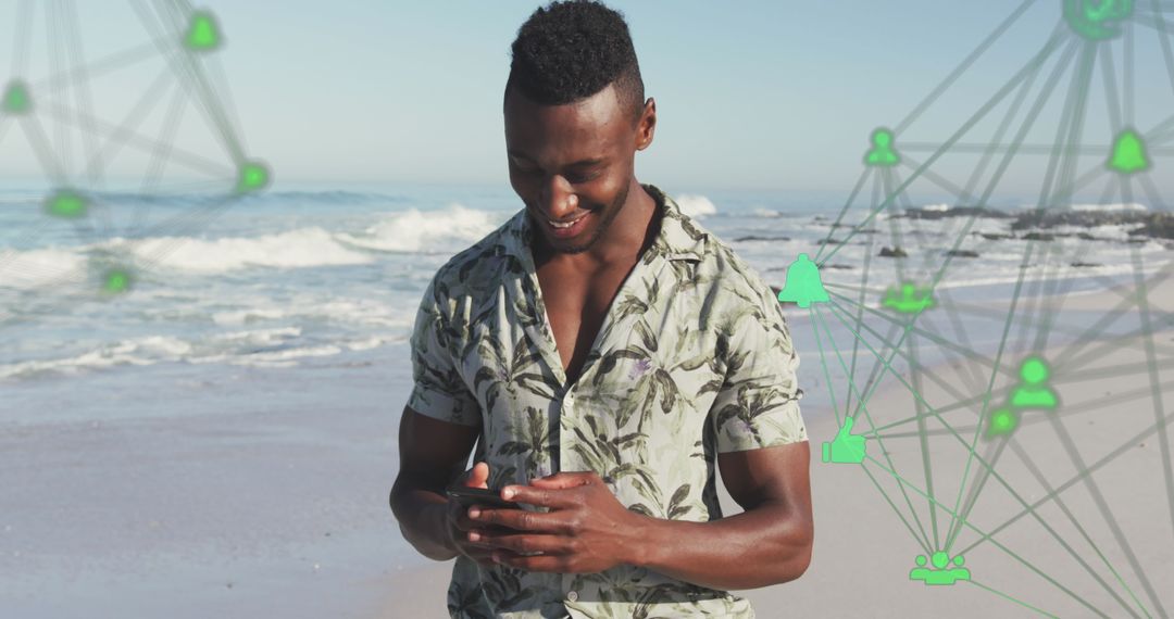 Man on Beach Connecting with Digital Network through Smartphone