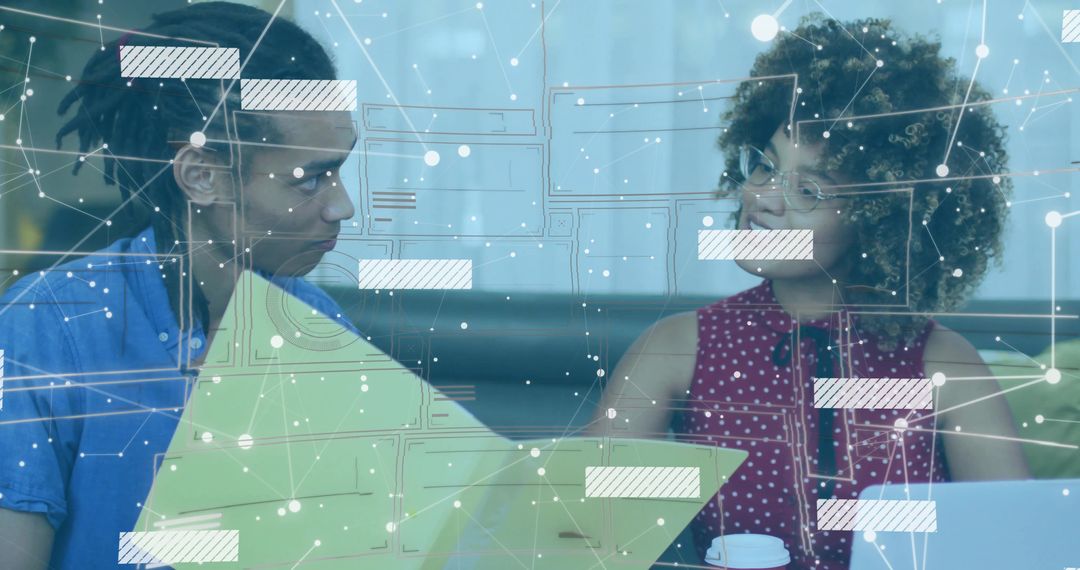 Colleagues Collaborating Over Laptop and Folder with Digital Network Overlay for Teamwork