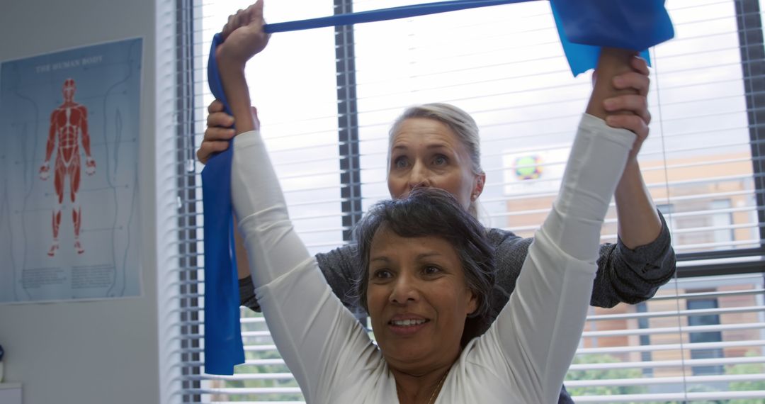 Female Physical Therapist Assisting Senior Woman with Resistance Band - Free Images, Stock Photos and Pictures on Pikwizard.com