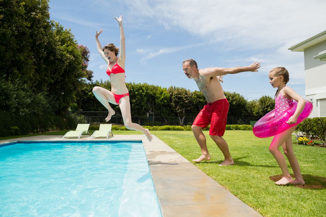 Family Jumping into Swimming Pool on Sunny Day - Free Images, Stock Photos and Pictures on Pikwizard.com