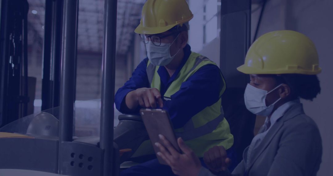 Team Collaborating on Forklift Operations in Warehouse Environment