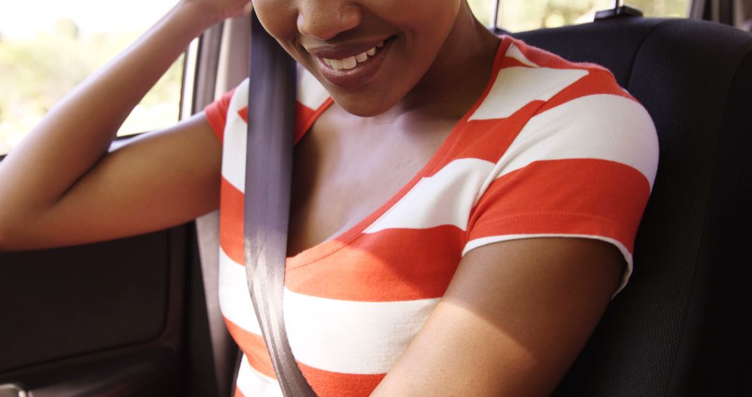 Smiling Woman Wearing Seatbelt While Sitting in Car - Free Images, Stock Photos and Pictures on Pikwizard.com