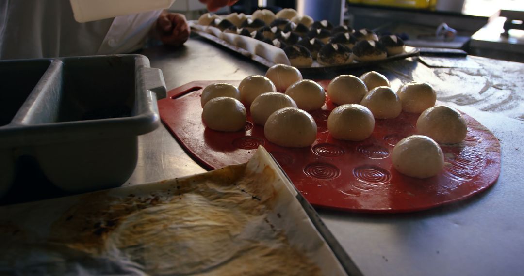 Chef Preparing Dough Balls in Industrial Kitchen - Free Images, Stock Photos and Pictures on Pikwizard.com