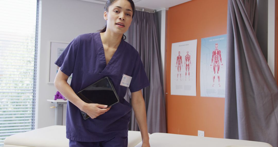 Female healthcare professional holding tablet in medical clinic - Free Images, Stock Photos and Pictures on Pikwizard.com