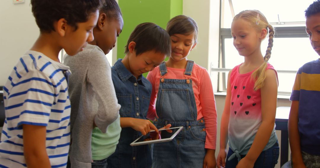 Children Collaborating on Tablet in Classroom Learning Environment