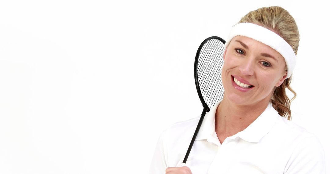 Smiling Female Tennis Player Holding Racket with Copy Space