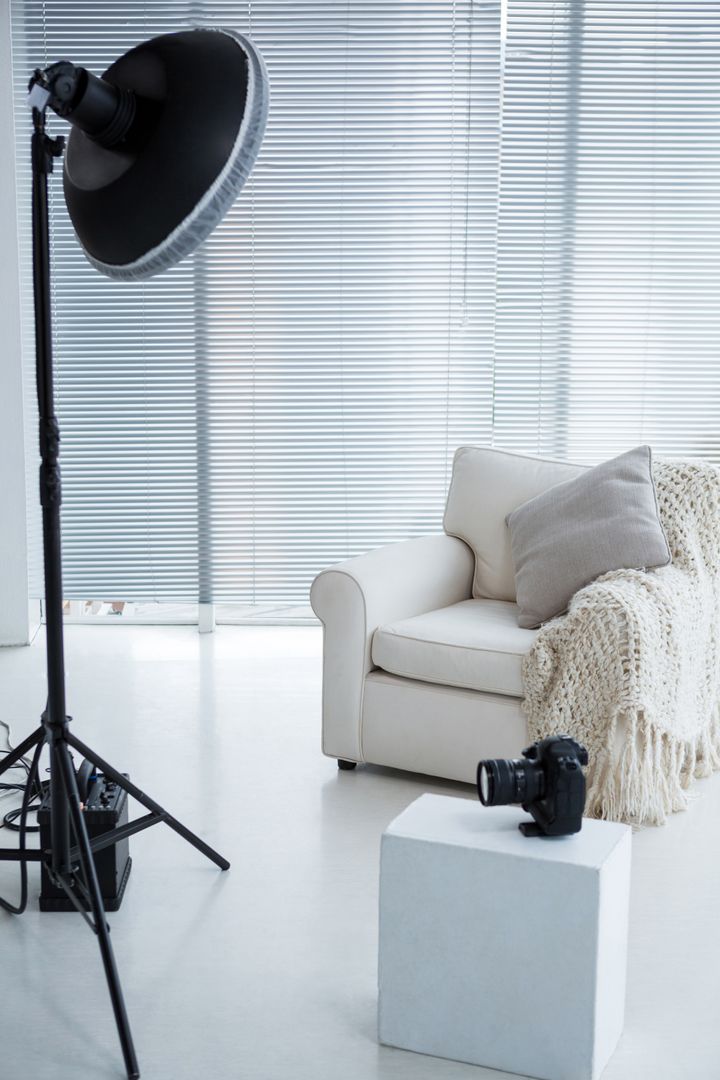Modern Photostudio with Armchair and Spotlight - Free Images, Stock Photos and Pictures on Pikwizard.com